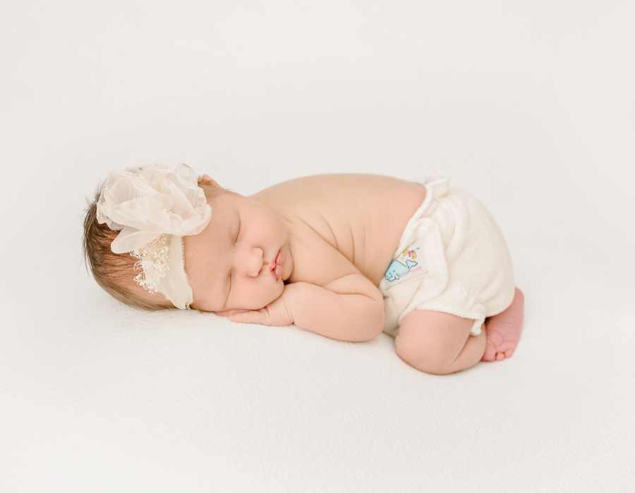 Sleeping newborn in a Mother-ease Sandy's Fitted Cloth Diaper